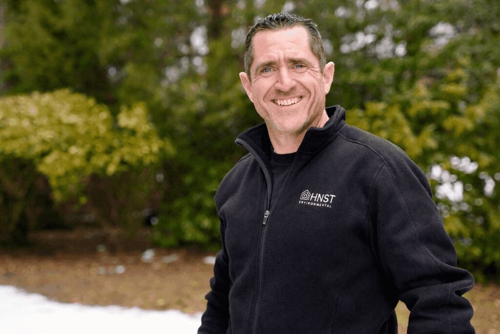 John Skelly, owner of HNST, smiles for a photo.