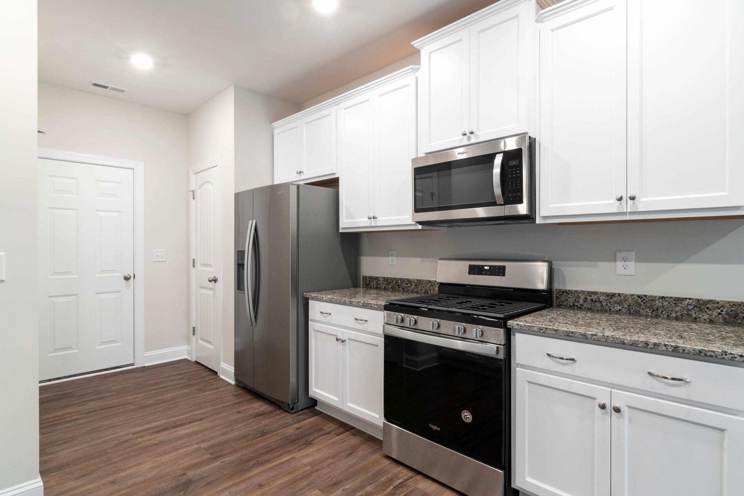 Clean, modern kitchen with new appliances in a home that may still have hidden moisture or mold concerns.