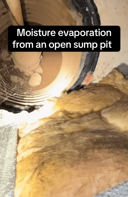 Moisture evaporating from a sump pit, illustrating how standing water can contribute to increased indoor humidity.